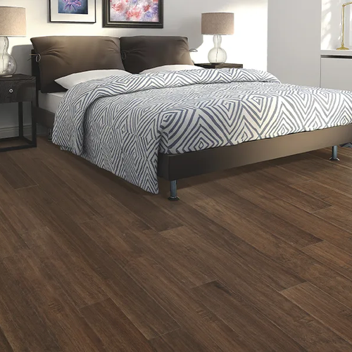 Dark wood floors in a classic bedroom