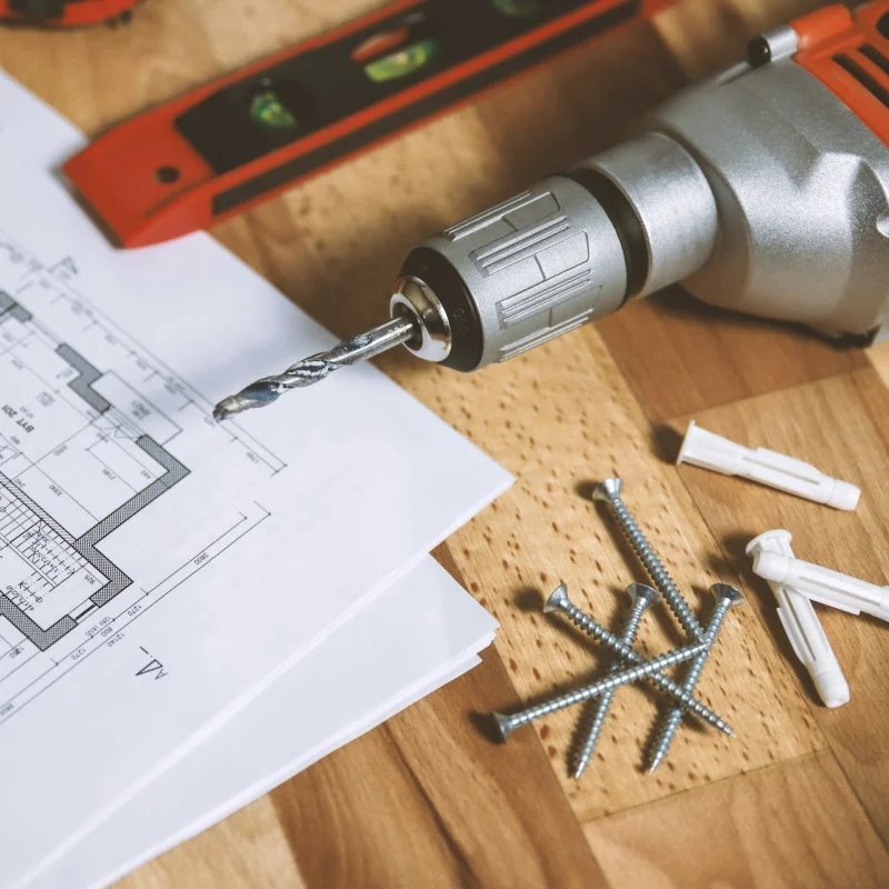 Home renovation tools on a wood surface