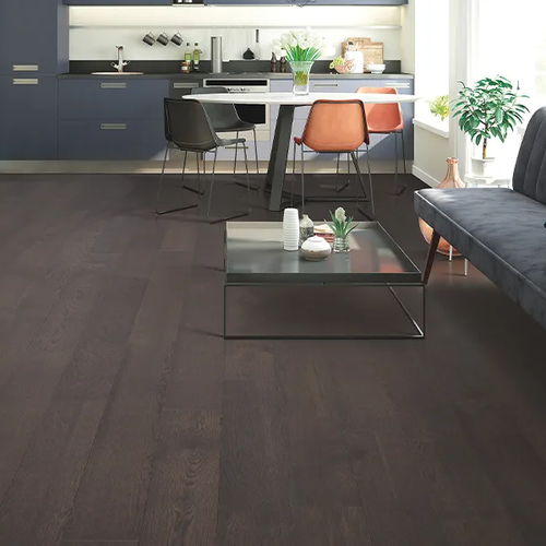 Dark wood flooring installed in a modern kitchen